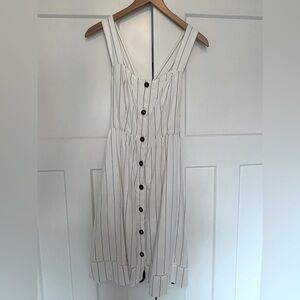 White sundress with black pin stripes.